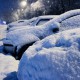 Car under the snow., winter weather vehicle concept. Cars blocked by snow on roads, street snow-paralysis of traffic, blizzard outdoors.