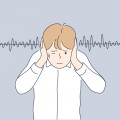 Noise, stress, protection concept Young frustrated depressed stressful boy kid child cartoon character plugged ears with hands from lound noisy sound or parents swearing. Family abuse illustration.